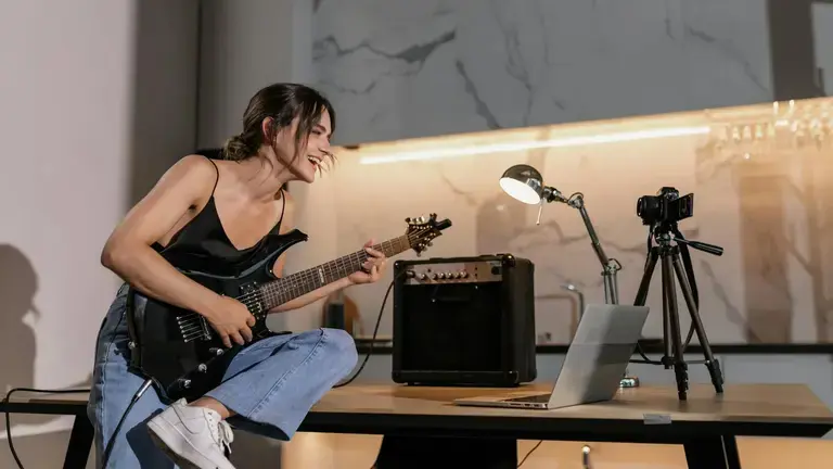 Woman learning guitar