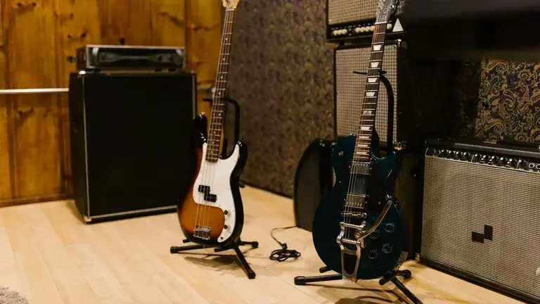 Two guitars on a stand