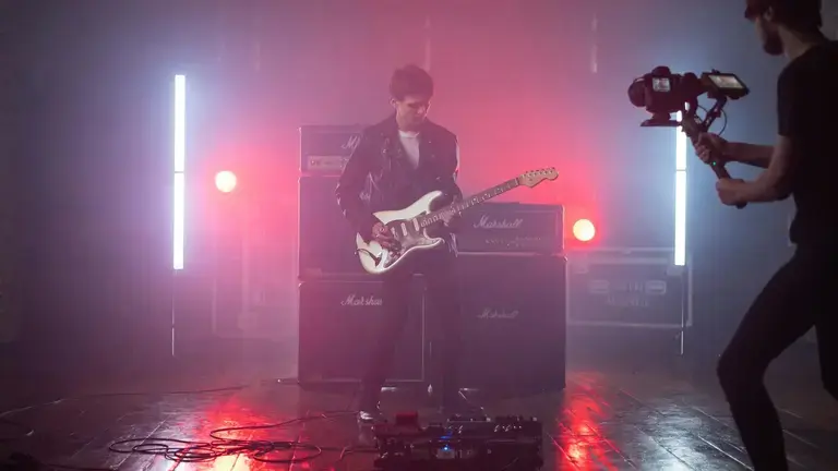 Guitarist in front of cab
