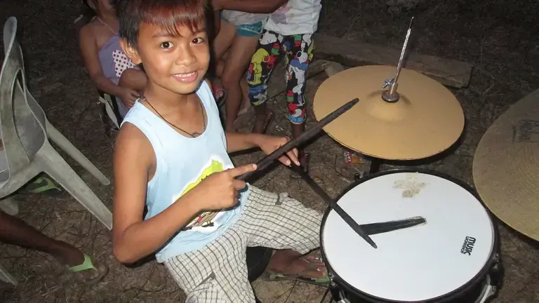 Kid on a drum
