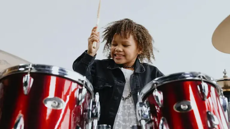 Child playing drums