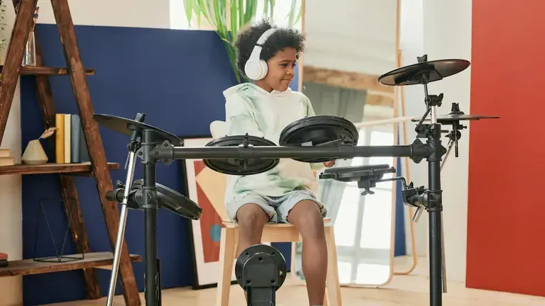 Child playing. drums