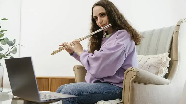 Person leraning flute online