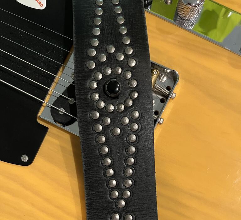 Red Monkey's Ace of Spades guitar strap features a bold silver stud pattern that makes my Telecaster look amazing.
