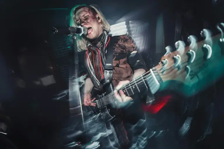 Image metal guitarist playing and singing