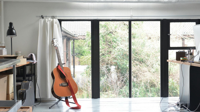 A guitar in a room