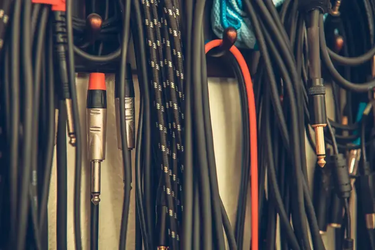 assortment of guitar cables