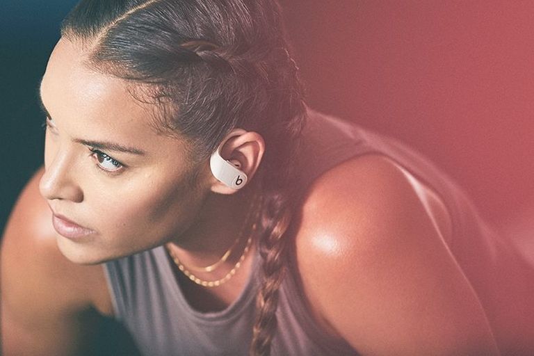 Photo of girl wearing Powerbeats Pro headphones while exercising