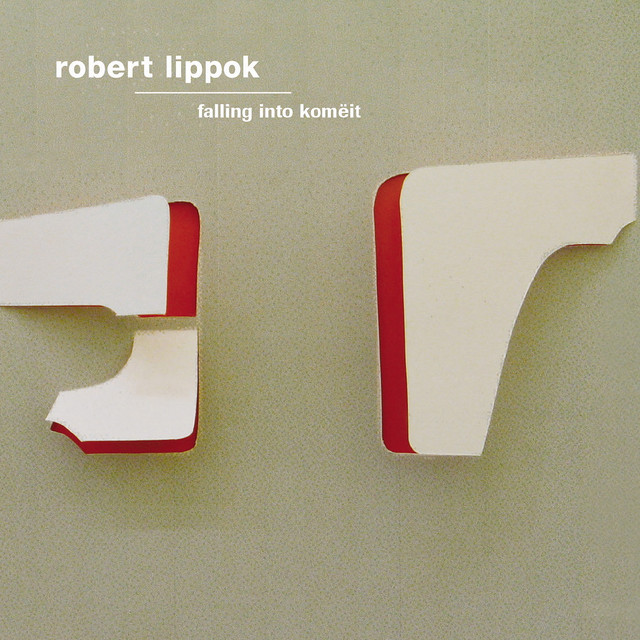 Falling Into Komëit album cover