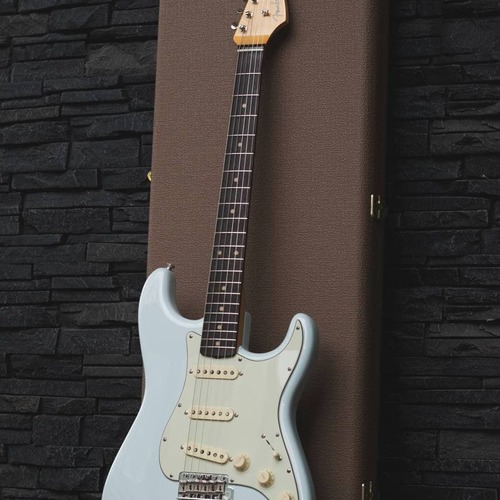 Photo of Fender 1962 AVRI Sonic Blue Stratocaster in a guitar