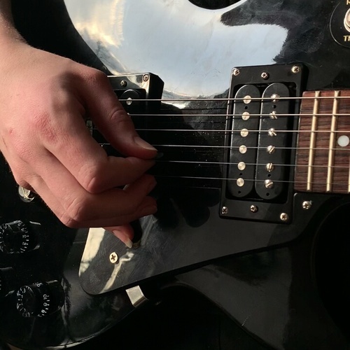 Photo of LTD MH-327 in a studio, guitar, and closeup