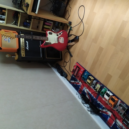 Photo of Marshall DSL5C and more gear in a pedalboard, guitar, and amplifier