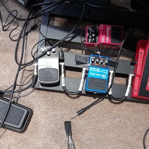 Photo of Boss VO-1 Vocoder and more gear in a pedalboard