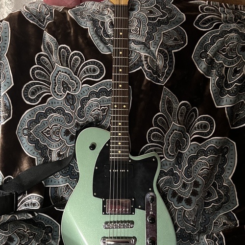Photo of Reverend Double Agent OG in a studio, guitar, and live