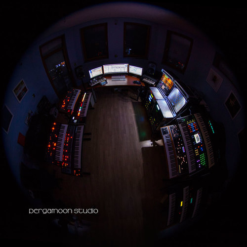 Photo of Access Virus Rack XL and more gear in a studio and synths