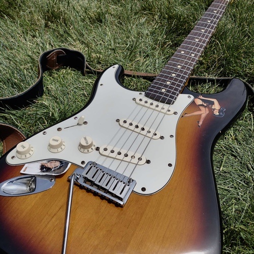 Photo of Fender American Deluxe Ash Stratocaster in a guitar