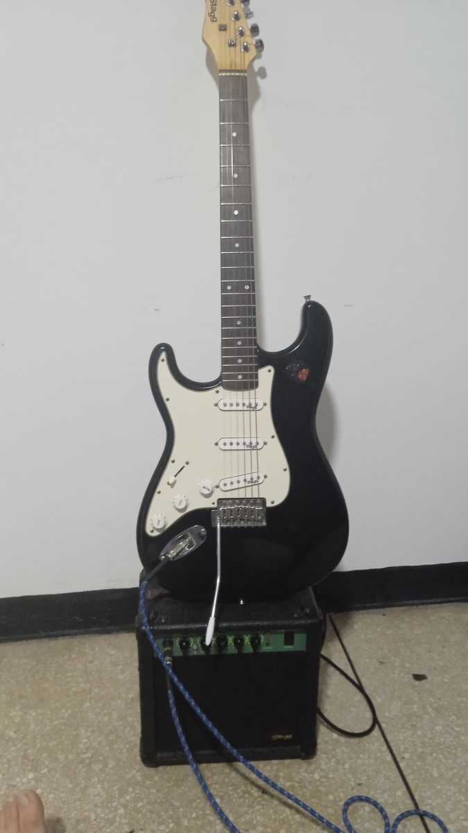 Stagg Amp Rig by eddy_rocker featuring Stagg Stratocaster, Stagg CA 15W Amplifier, and Alice 1.20mm Guitar Picks