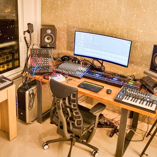 Photo of Elektron Digitone Keys and more gear in a studio and synths