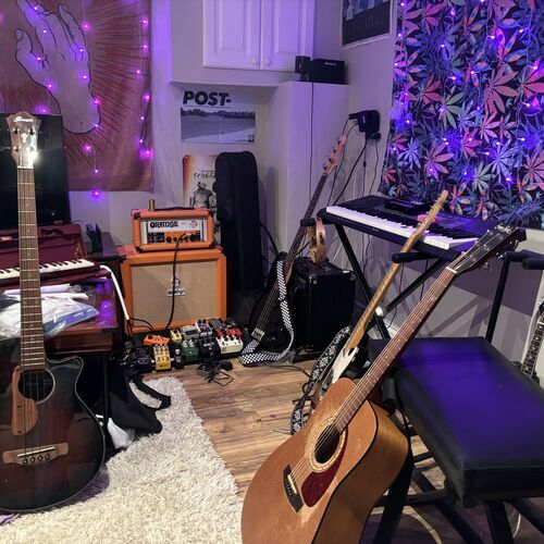 Photo of Mandolin and more gear in a pedalboard, guitar, and amplifier