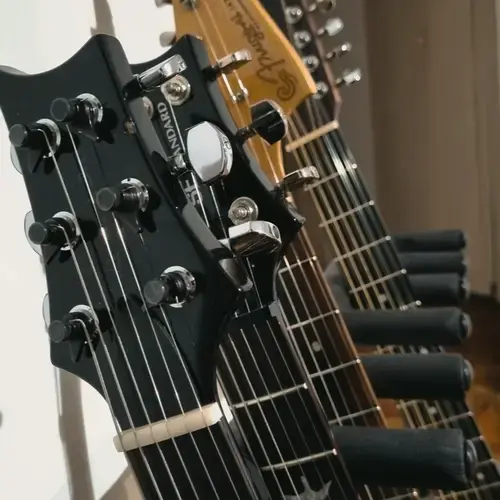 Photo of Sigma DM12-1ST and more gear in a studio and guitar