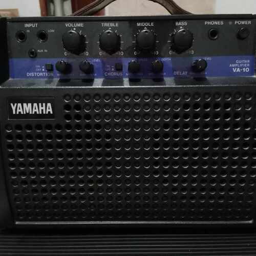 Photo of Yamaha VA-10 in a pedalboard, guitar, and amplifier