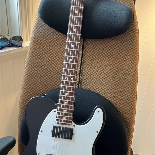 Photo of Squier Jim Root Telecaster in a guitar and closeup