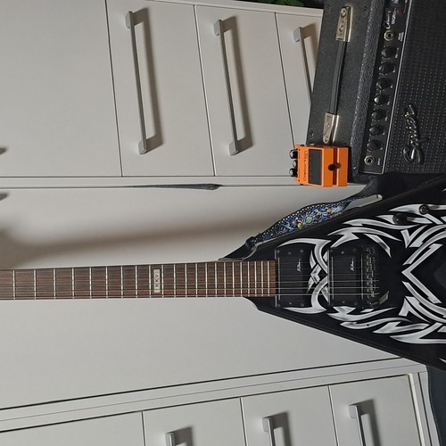 Photo of B.C. Rich Kerry King V and more gear in a pedalboard, guitar, and amplifier