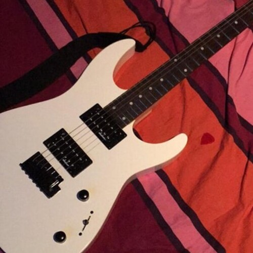Photo of Jackson JS12 Dinky in a studio, guitar, and closeup