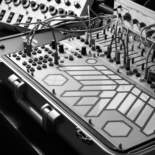 Photo of Buchla Easel-K and more gear in a studio and synths