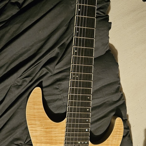 Photo of Schecter C-7 SLS Elite in a guitar and closeup