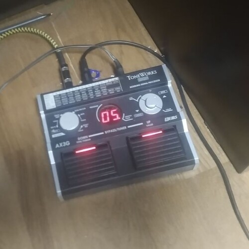 Photo of Korg Ax3g in a pedalboard and studio
