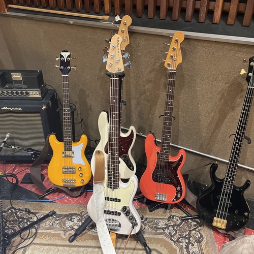 Photo of Ampeg B-15 and more gear in a studio, amplifier, and bass