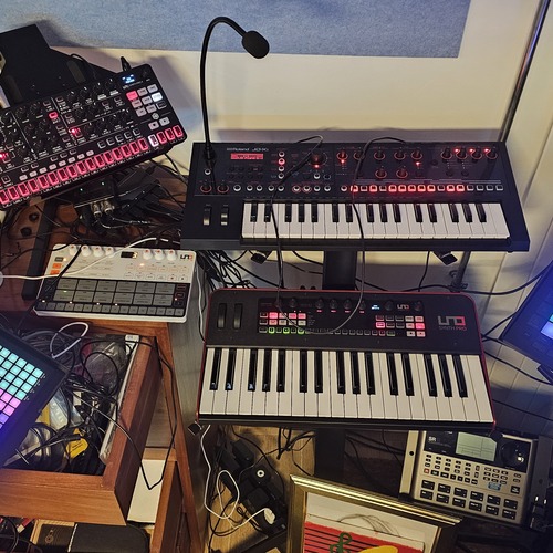 Photo of Alesis SR-18 and more gear in a studio and synths