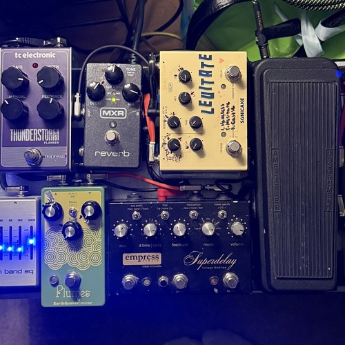 Photo of Valeton GP-5 and more gear in a pedalboard, pedal, and guitar