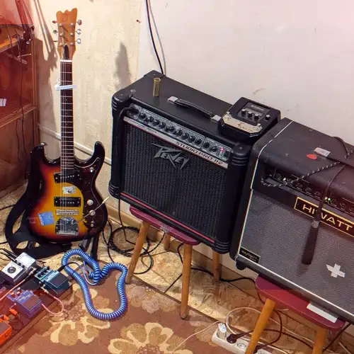 Photo of Yamaha Magicstomp and more gear in a pedalboard, guitar, and amplifier