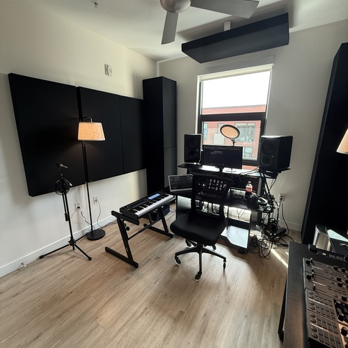 Photo of Omnirax Presto and more gear in a studio and DJ