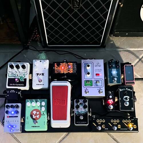 Photo of Teisco Delay and more gear in a pedalboard and amplifier