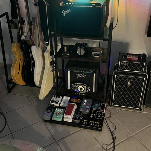 Photo of Peavey Rage 108 and more gear in a pedalboard, guitar, and amplifier