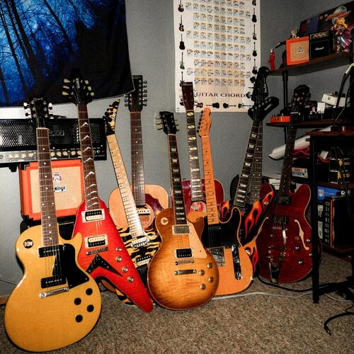 Photo of Epiphone Dot Deluxe and more gear in a guitar and amplifier