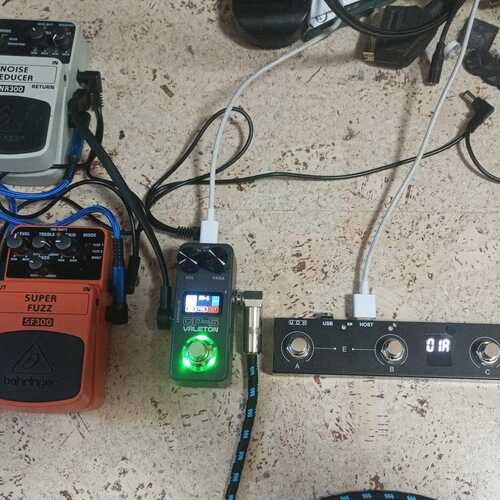 Photo of Valeton GP-5 and more gear in a pedalboard, pedal, studio, and guitar