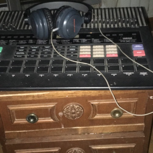 Photo of Yamaha RX-5 in a studio and drum machine