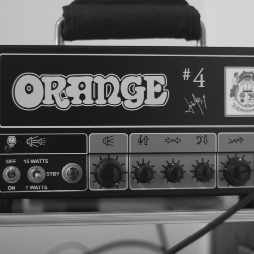 Photo of Orange Amplifiers Tiny Terror Jim Root #4 Signature 15W Tube Guitar Amp Head in a guitar, amplifier, camera, and lens