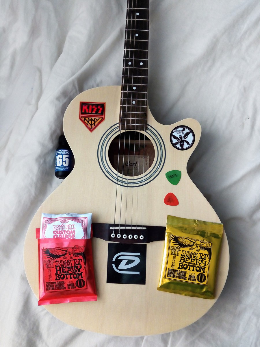 Music Gear Setup by ignatiusshow featuring Dunlop Tortex Standard 0.60mm Guitar Picks, Ernie Ball Skinny Top Heavy Bottom Slinky Guitar Strings (10-52), and Cort SFX10 Acoustic Electric Guitar and 3 more pieces of gear