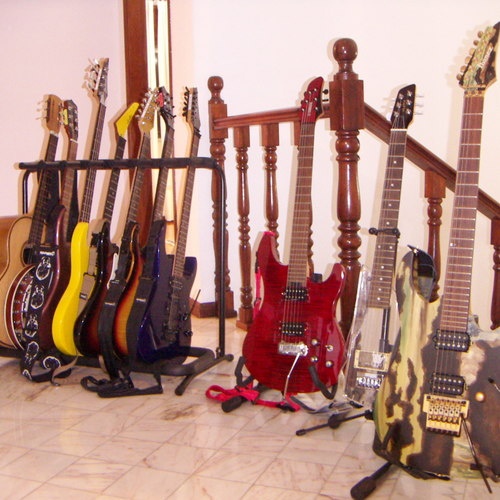 Photo of Wesley Jasper-10 and more gear in a studio and guitar